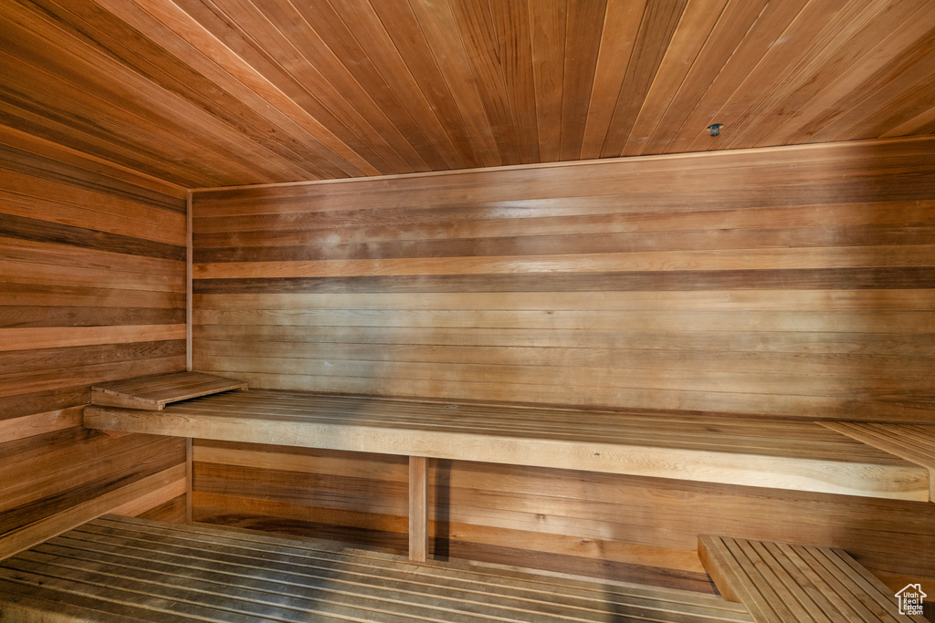 Sauna / steam room with wooden walls and wooden ceiling