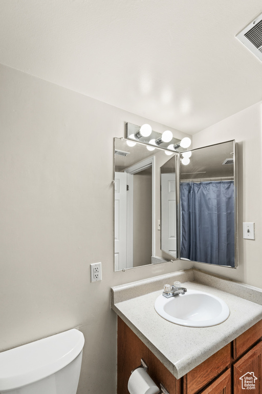 Bathroom with toilet and vanity