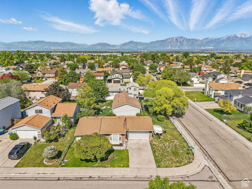 Aerial view of residential area featuring a mountain backdrop