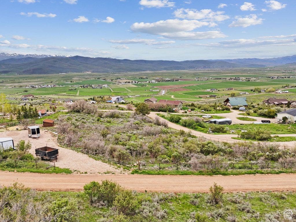 Overview of rural landscape with a mountain backdrop