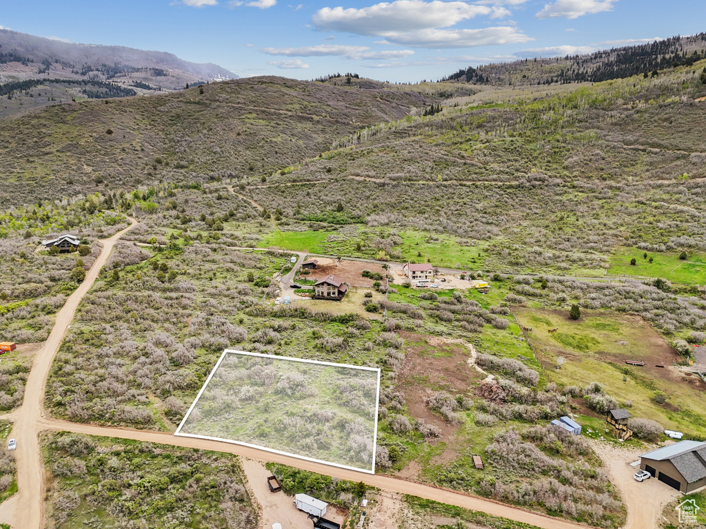 View of rural area with property parcel outlined and a mountain backdrop