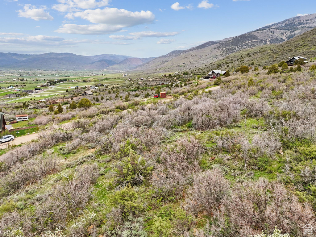 View of mountain backdrop featuring rural landscape