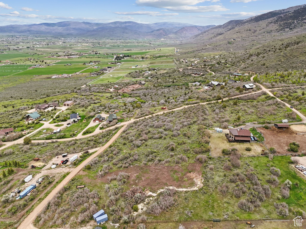 Aerial overview of property\\\'s location featuring a mountain backdrop and rural landscape