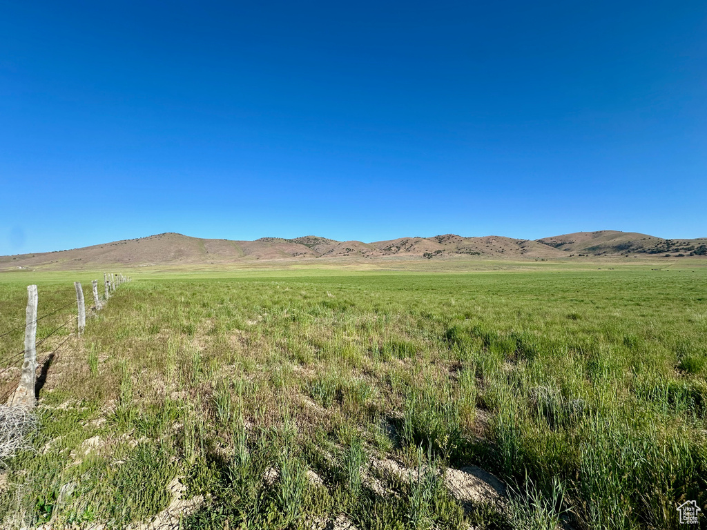 View of mountain background featuring rural landscape