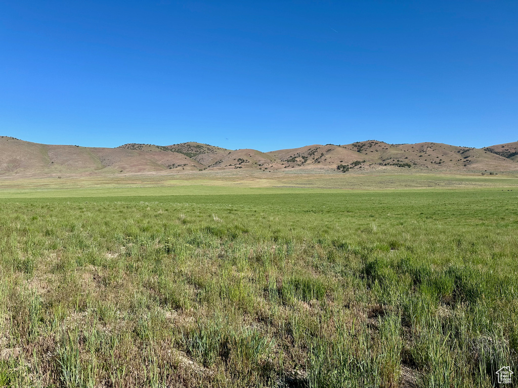 View of mountain backdrop featuring rural landscape
