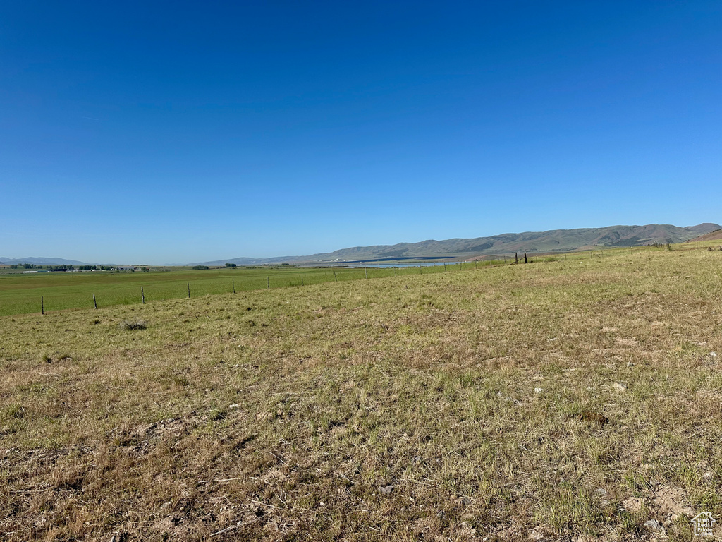 View of mountain backdrop featuring rural landscape
