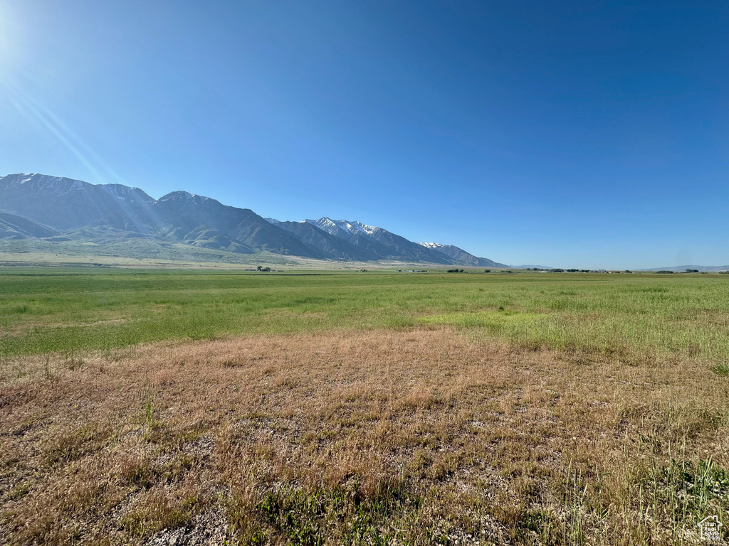 View of mountain backdrop with rural landscape