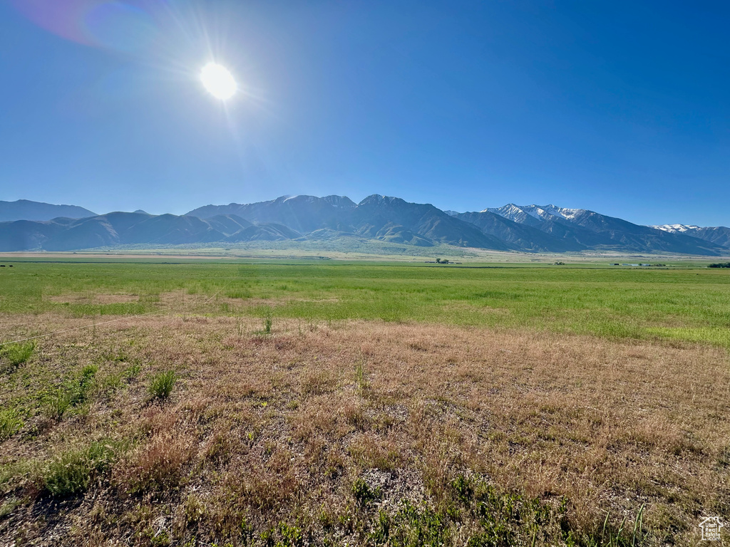 View of mountain backdrop with rural landscape