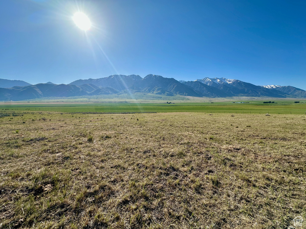 View of mountain background featuring rural landscape