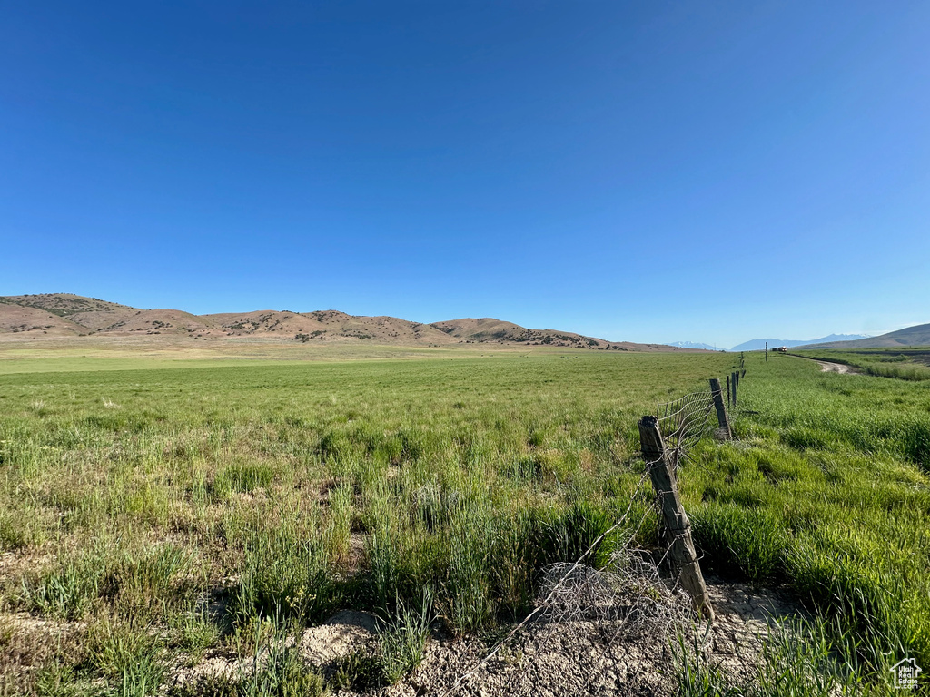 View of mountain background featuring rural landscape