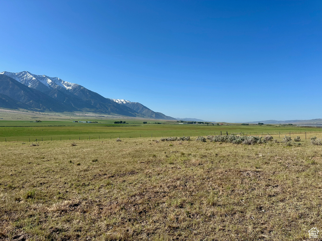View of mountain backdrop featuring rural landscape