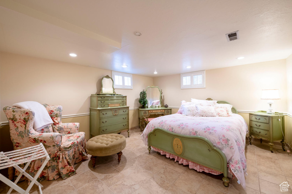 Bedroom with visible vents and recessed lighting
