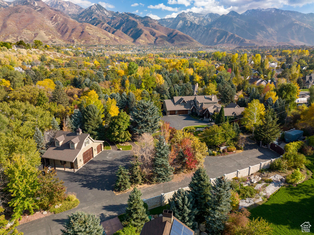 Birds eye view of property with a mountain view
