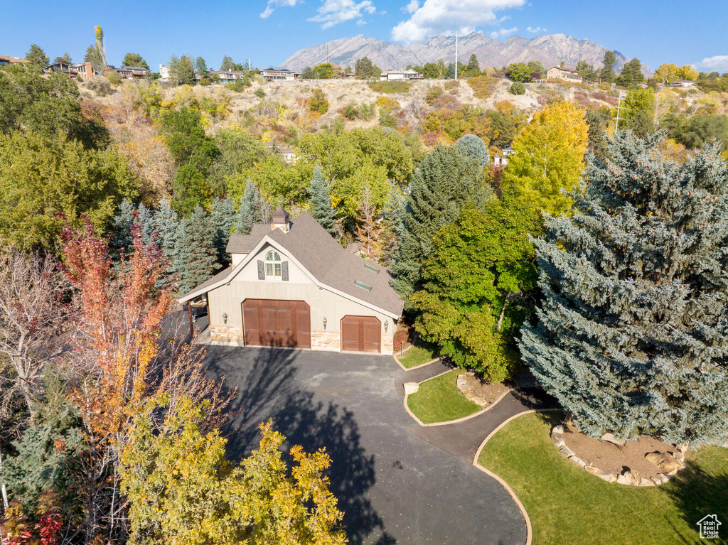 Birds eye view of property with a mountain view