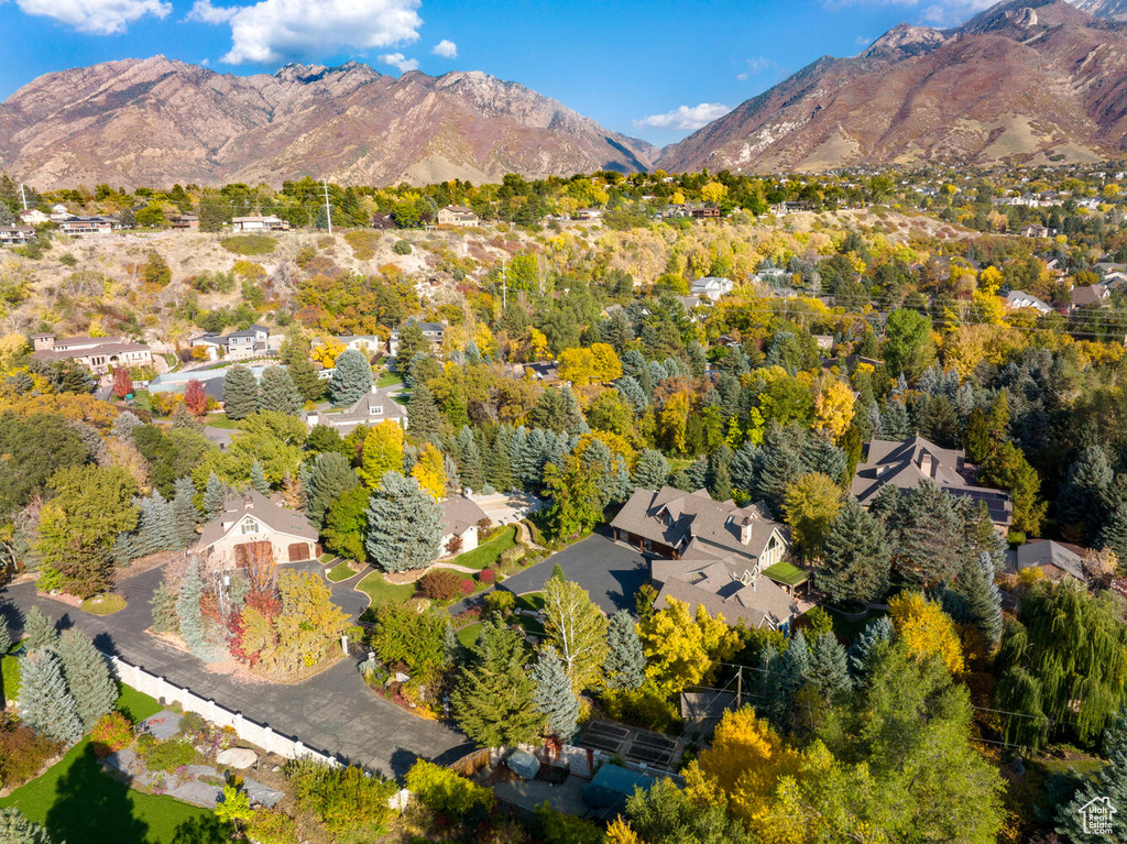 Birds eye view of property with a mountain view