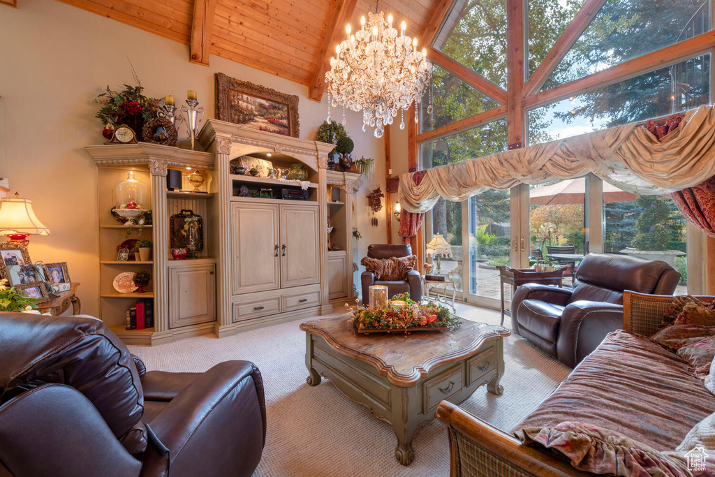 Living room with high vaulted ceiling, wooden ceiling, a notable chandelier, carpet flooring, and beam ceiling