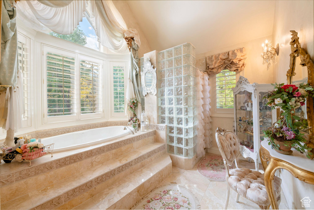 Full bathroom with walk in shower and a bath