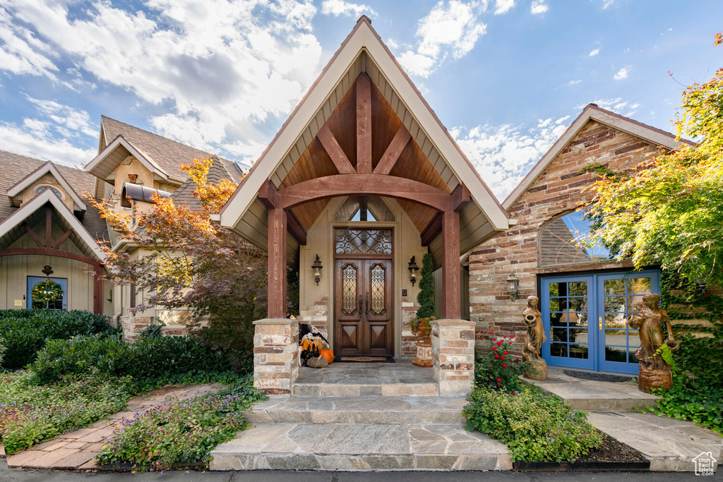 Entrance to property with french doors and brick siding