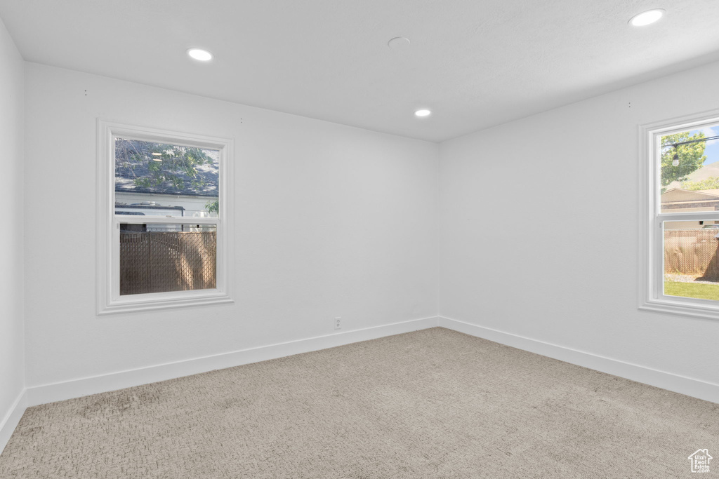 Spare room with carpet, recessed lighting, and baseboards