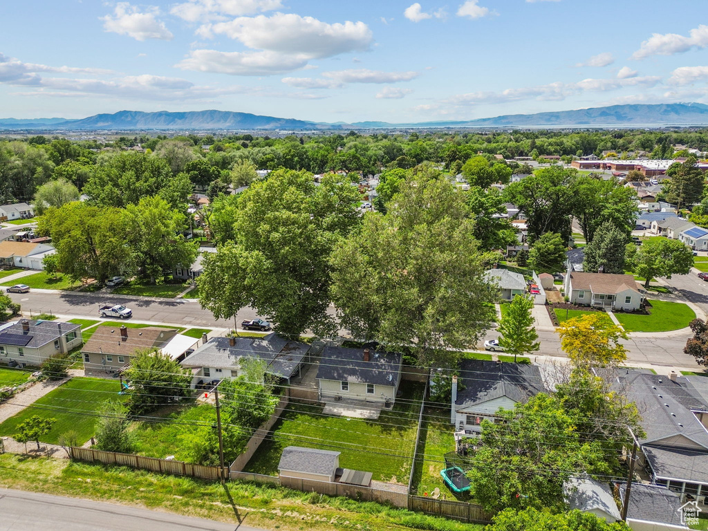 Aerial perspective of suburban area with a mountain backdrop