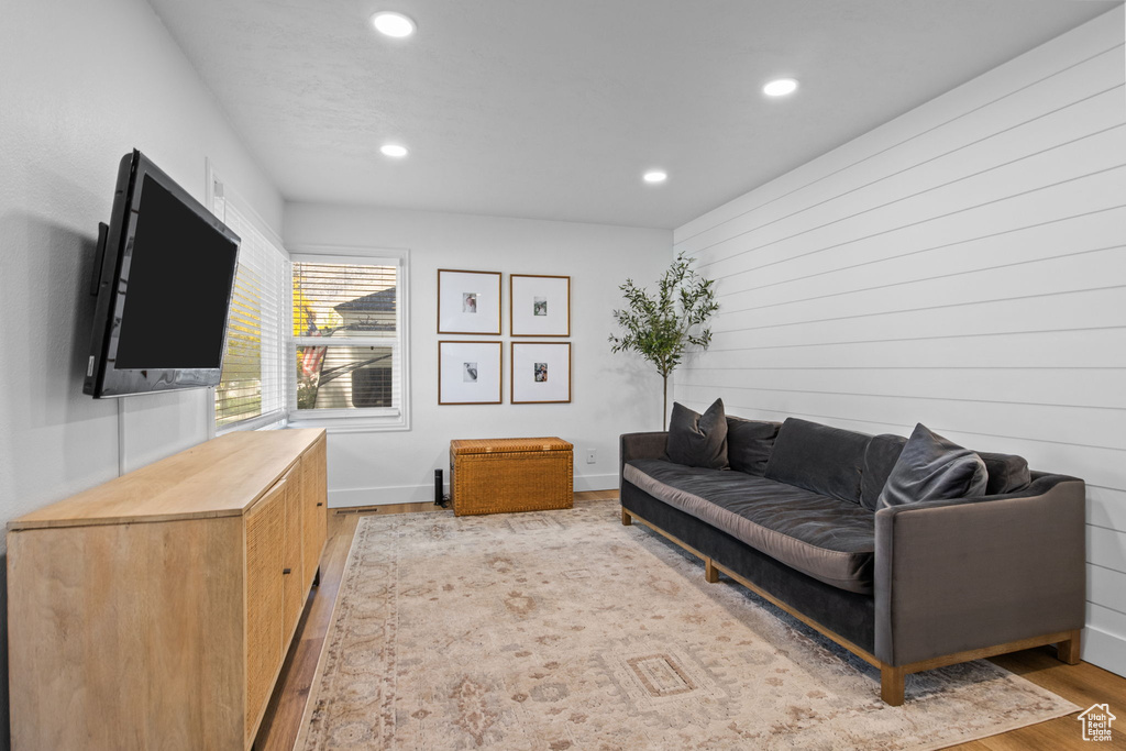 Living area featuring recessed lighting, light wood-style flooring, and baseboards