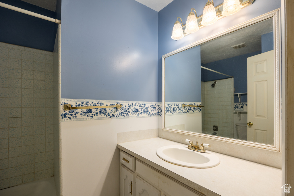 Full bathroom featuring vanity and shower / bathtub combination