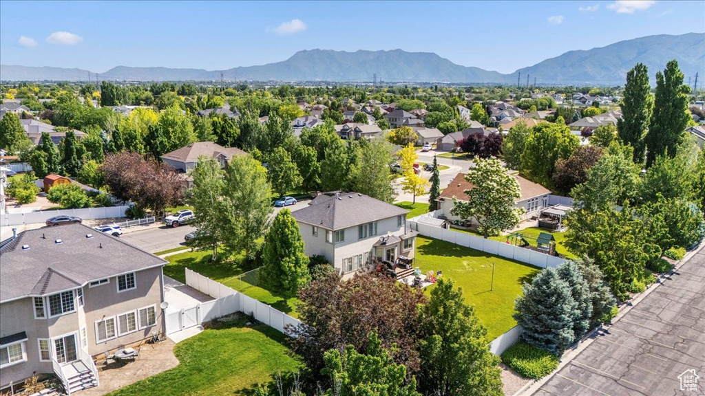 Aerial view of residential area featuring mountains