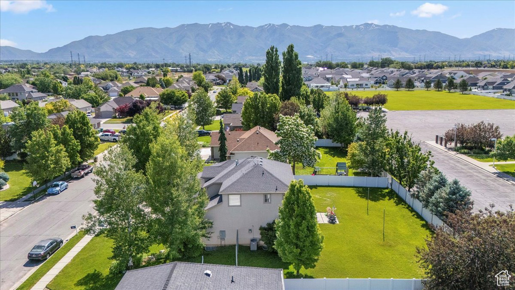 Aerial perspective of suburban area with a mountainous background