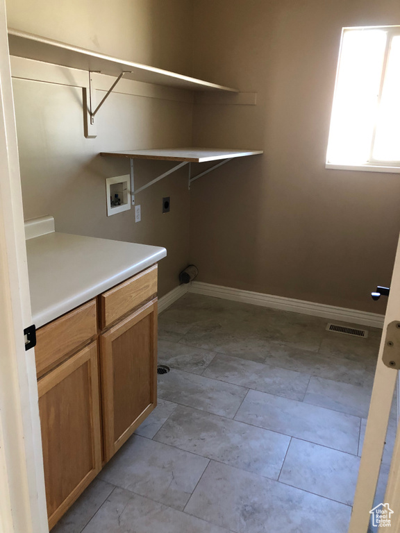 Washroom featuring washer hookup, electric dryer hookup, and baseboards