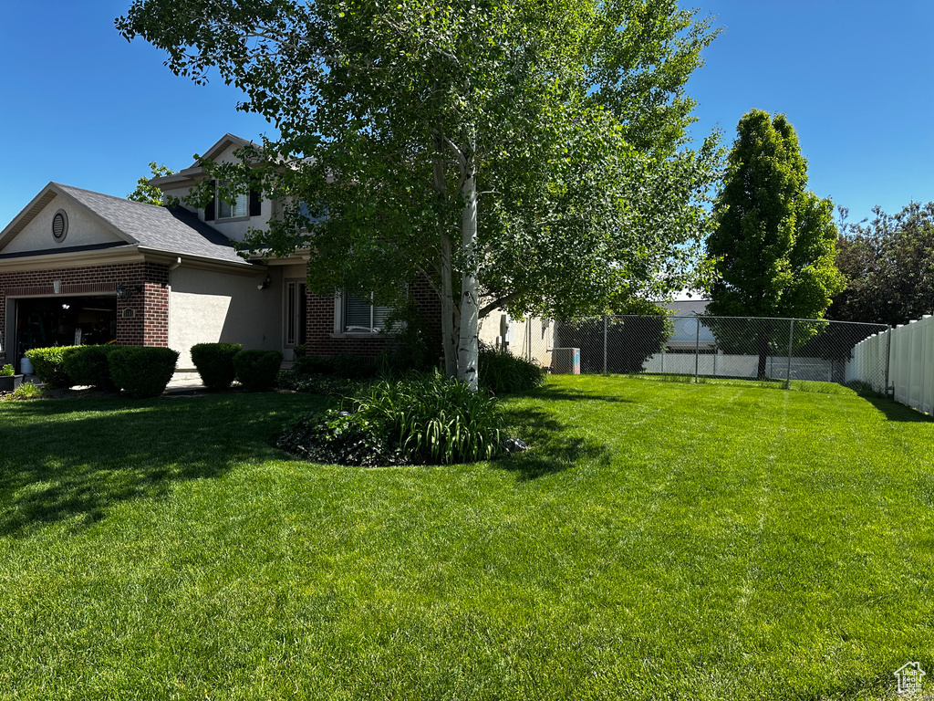 View of yard with a garage
