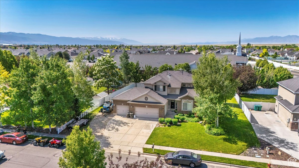 Aerial view of residential area featuring mountains