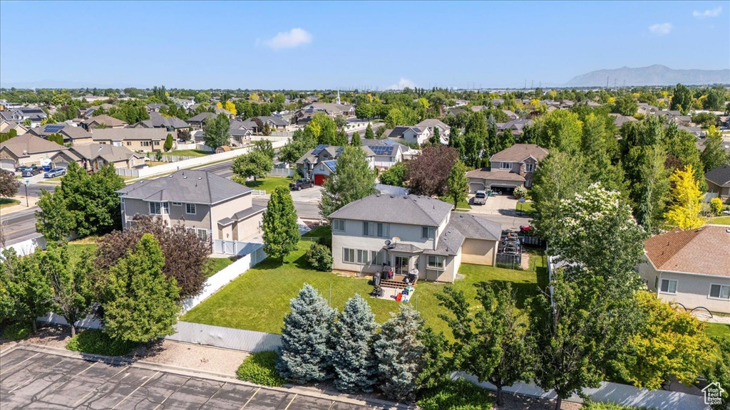 Aerial view of residential area featuring a mountain backdrop
