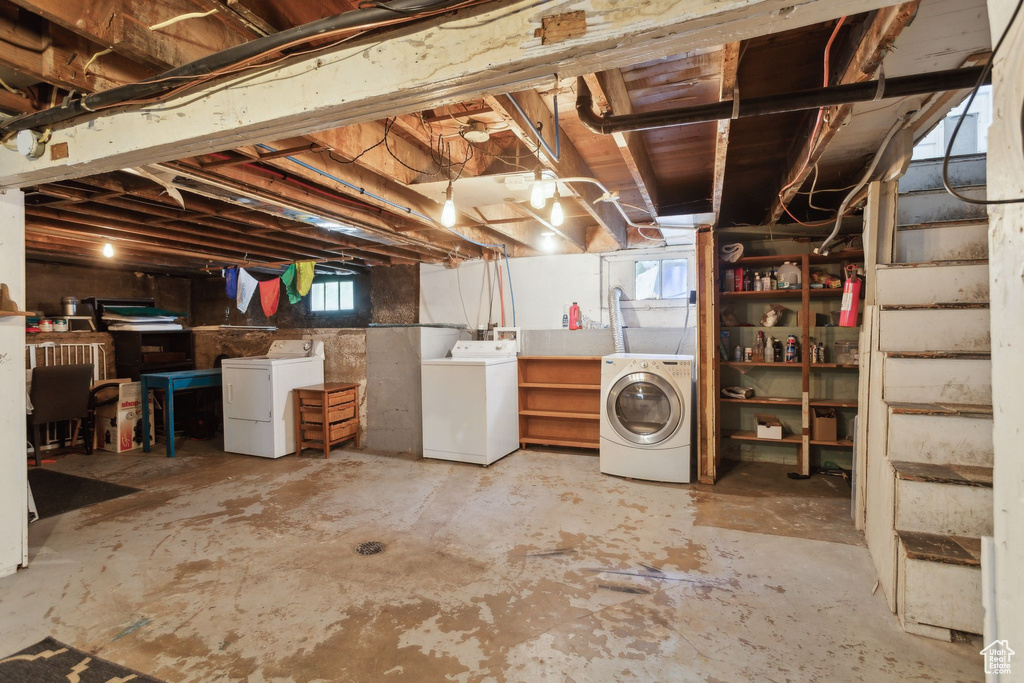 Basement featuring separate washer and dryer and stairs
