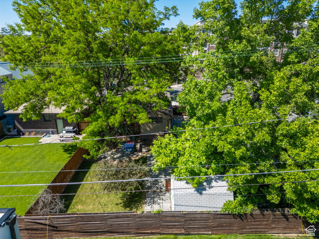 Aerial overview of property\\\'s location with property boundaries highlighted and a tree filled landscape