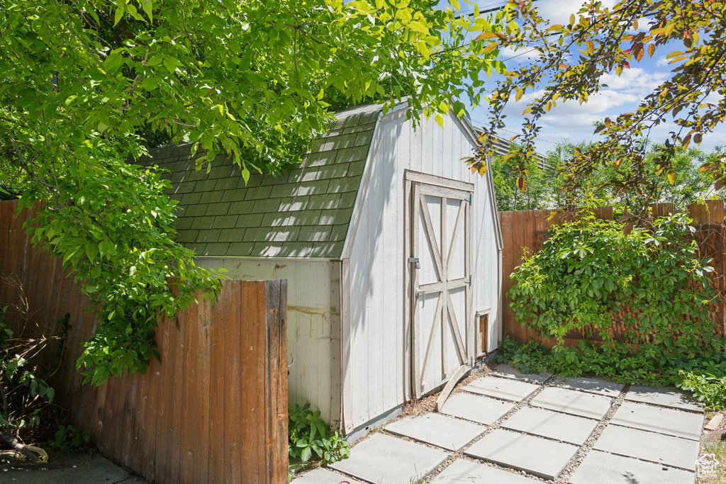View of shed with a fenced backyard