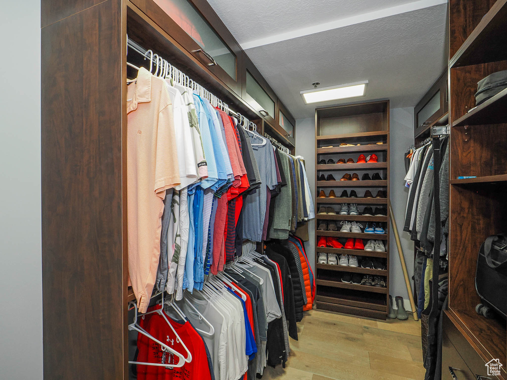 Spacious closet with wood finished floors