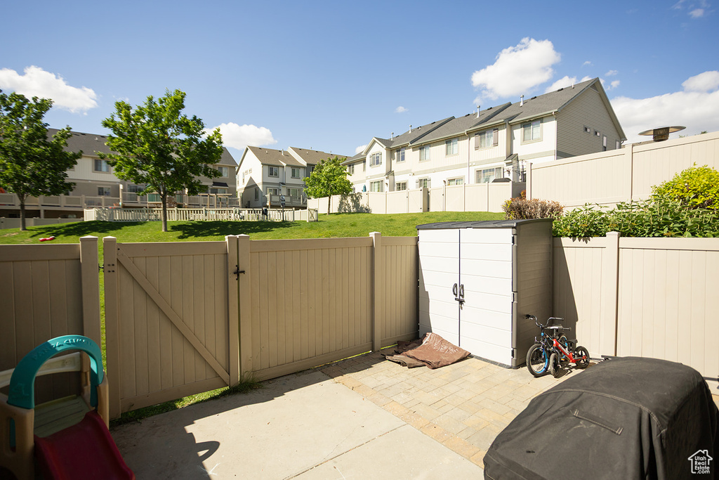 View of patio / terrace with a residential view and a gate