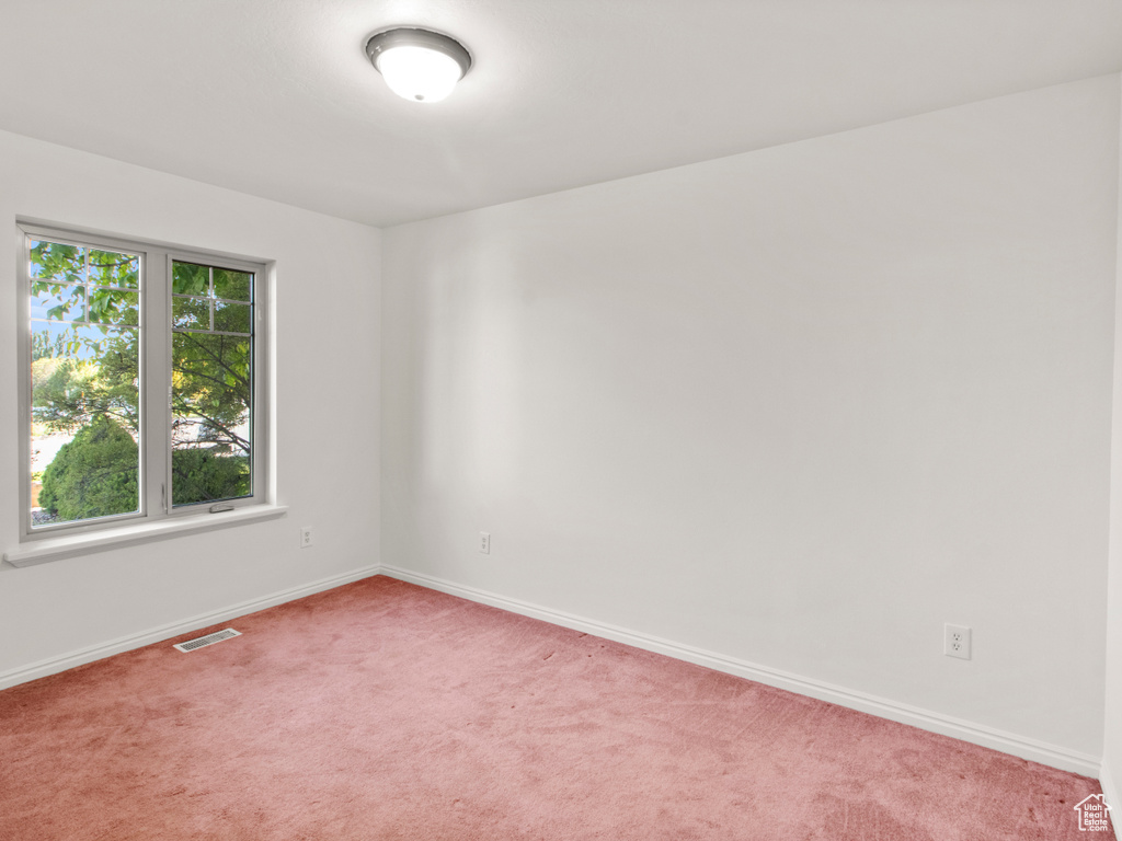 Spare room with carpet flooring and baseboards