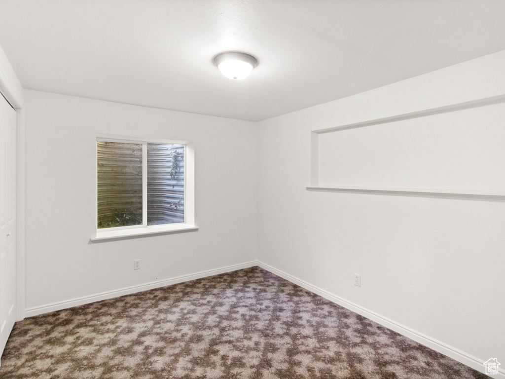 Spare room with carpet flooring and baseboards