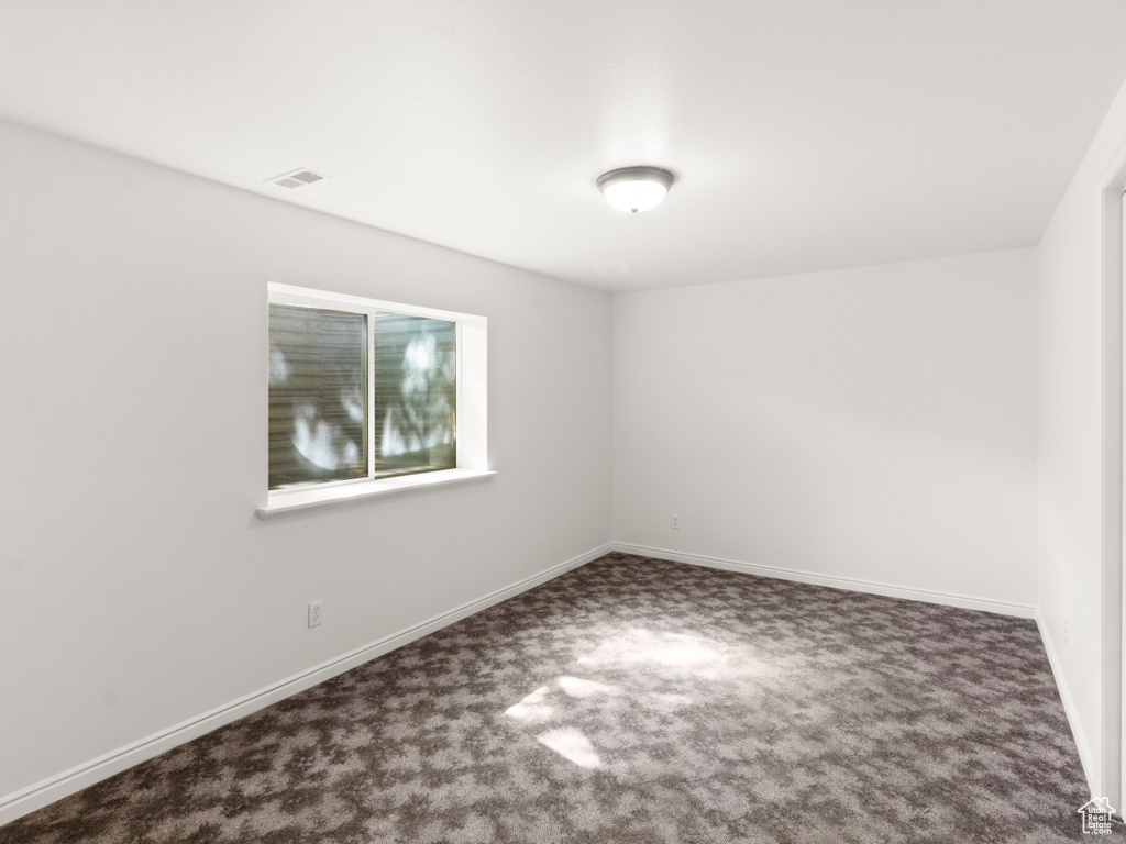 Spare room with carpet flooring and baseboards