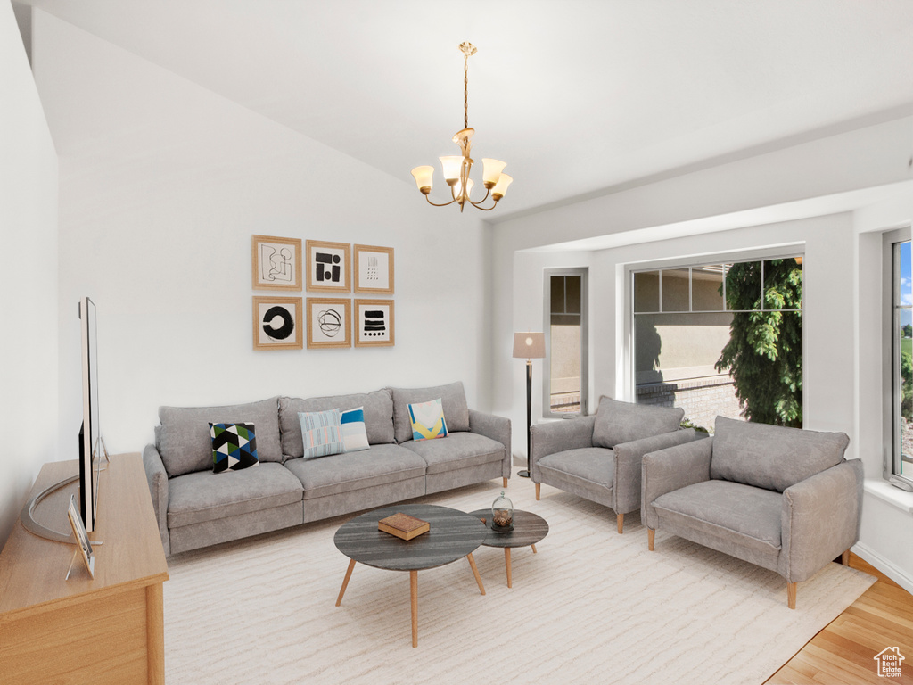 Living room featuring a chandelier and light wood-type flooring