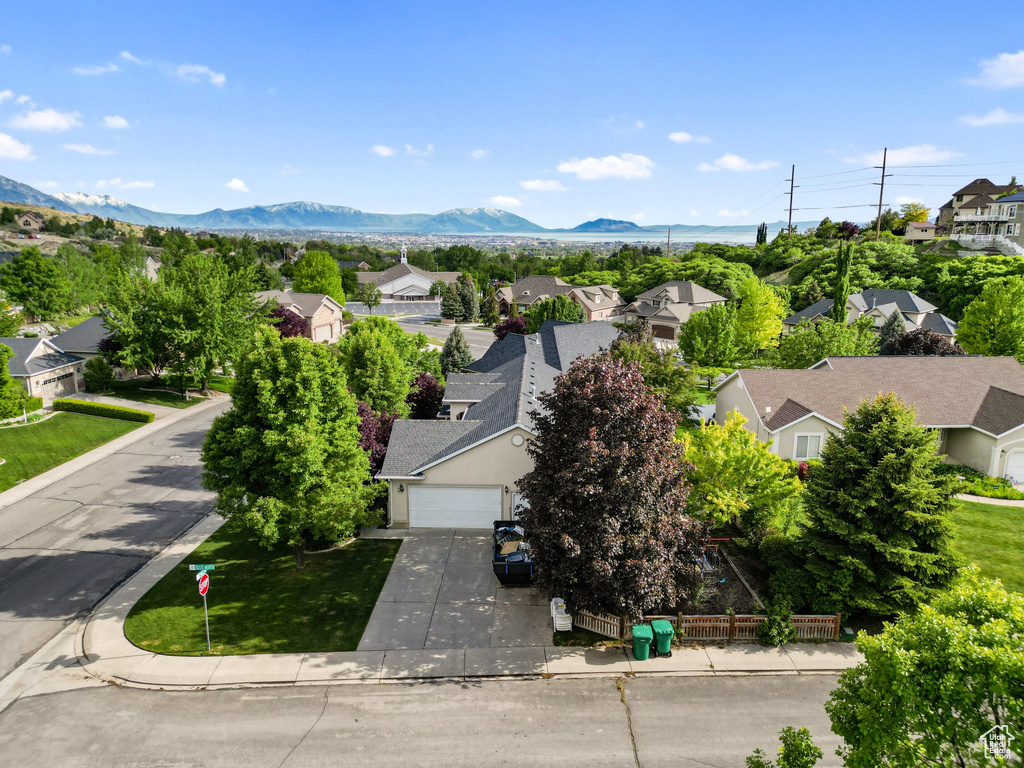 Aerial view of residential area featuring a mountain backdrop