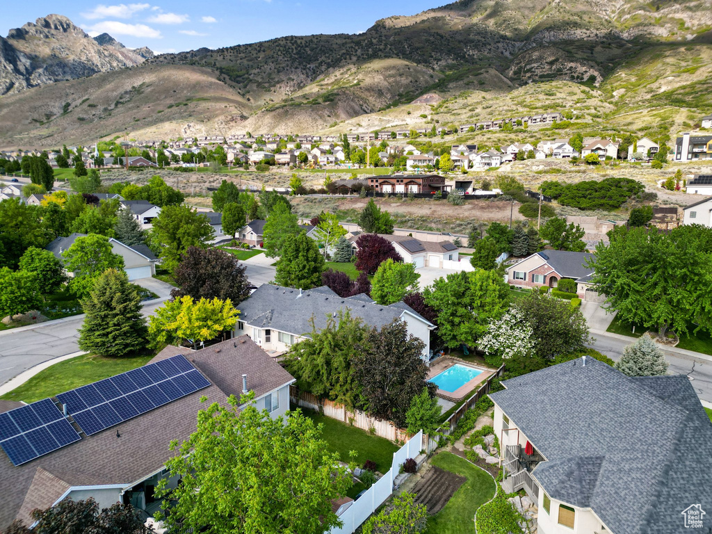 Aerial perspective of suburban area with a mountainous background