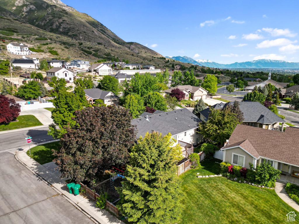 Aerial view of residential area with a mountain backdrop