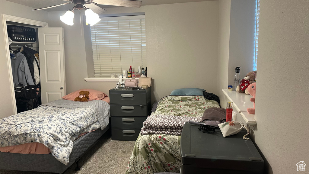 Bedroom with carpet flooring and a ceiling fan