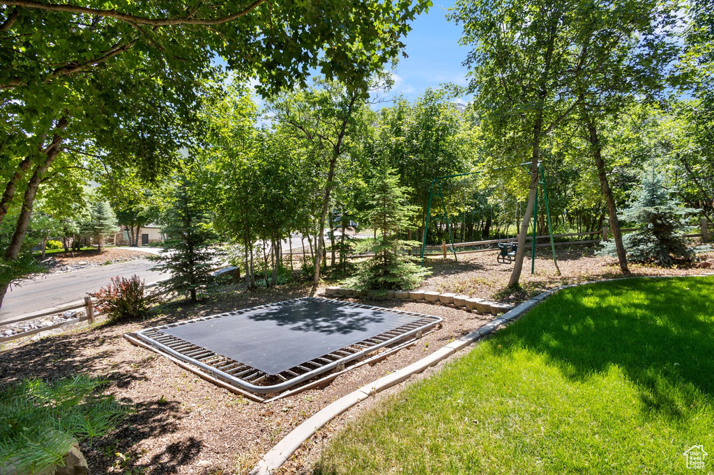 View of grassy yard with a playground