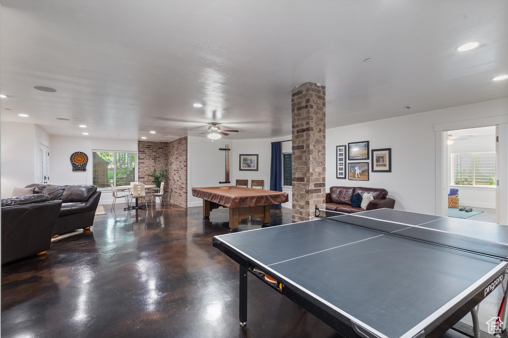 Rec room with a ceiling fan, plenty of natural light, billiards table, concrete floors, and recessed lighting