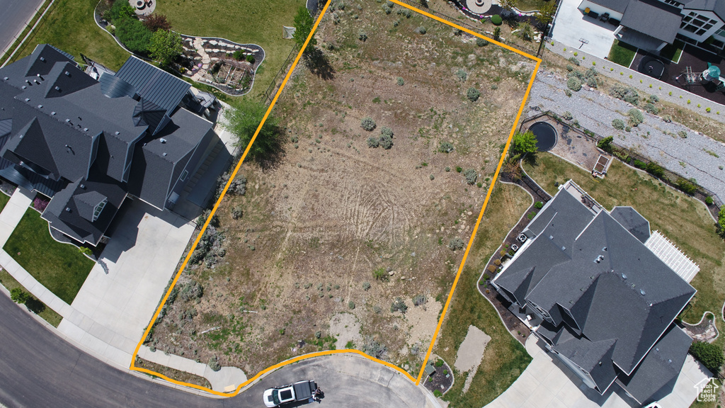 Aerial overview of property\\\'s location featuring property parcel outlined