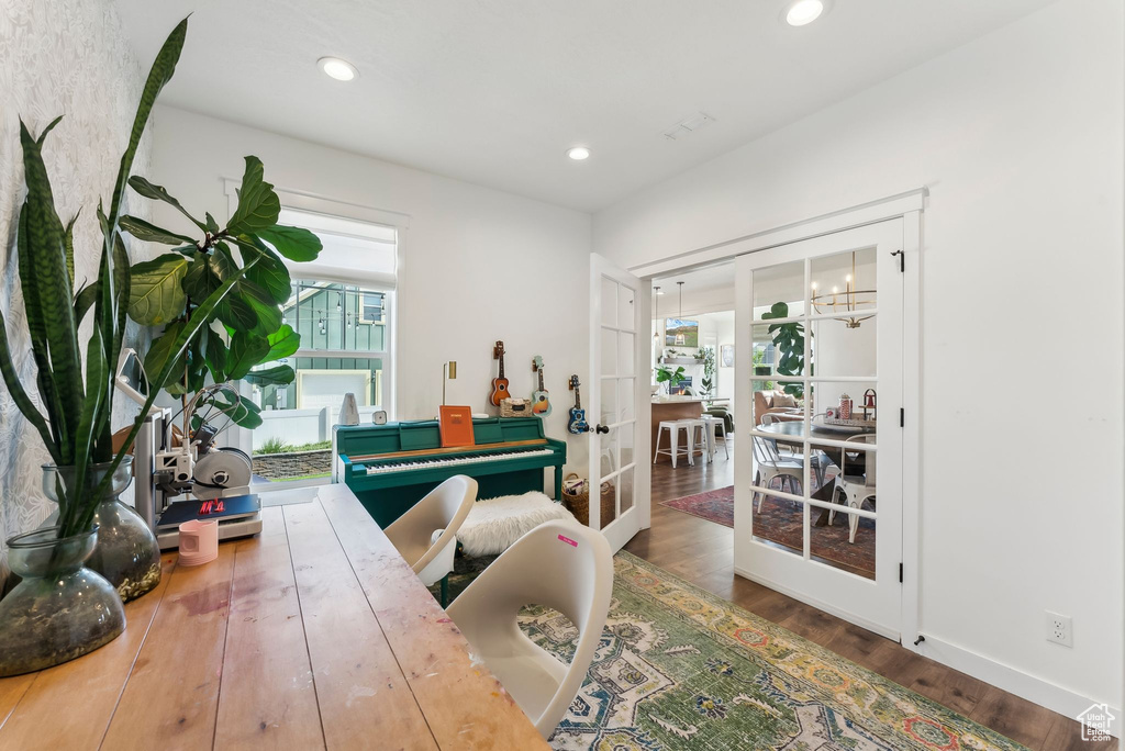 Dining area featuring french doors, wood finished floors, recessed lighting, and baseboards