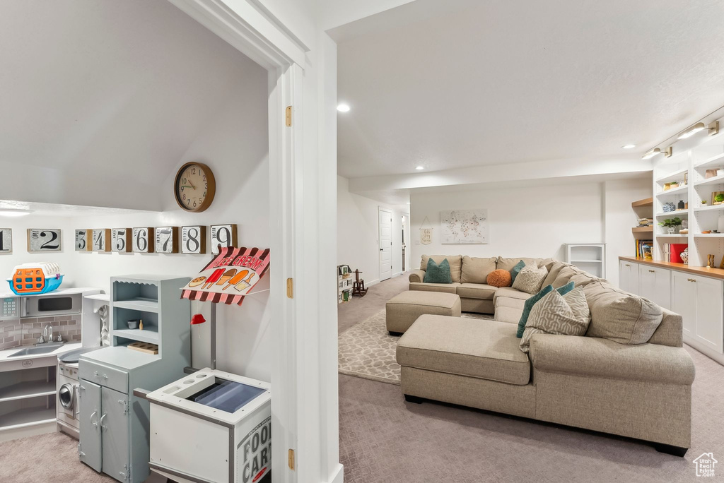 Living area with carpet flooring and recessed lighting